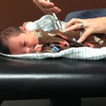 baby Henry being adjusted