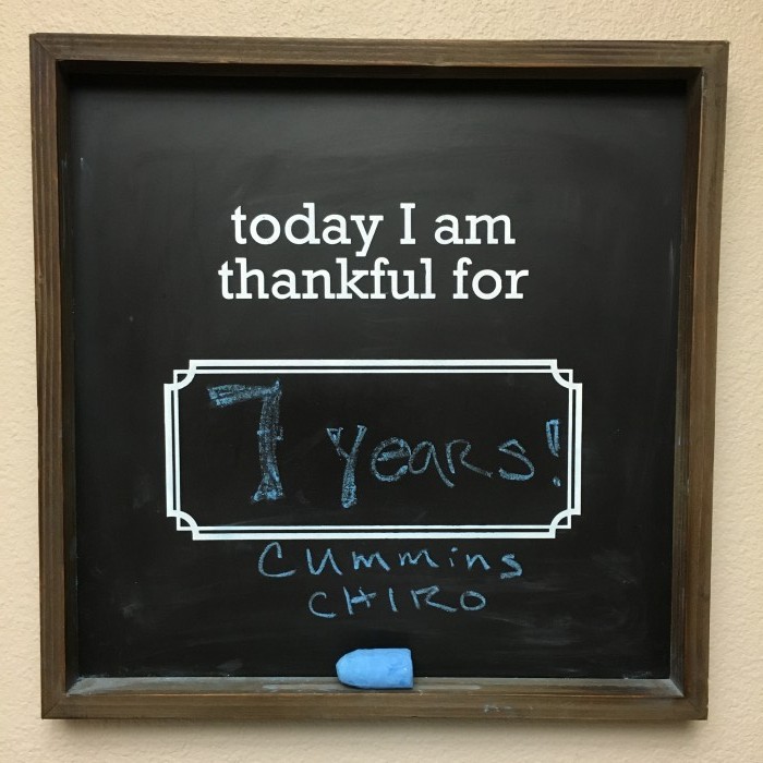 Photo of chalkboard with text reading, today I am thankful for 7 years!