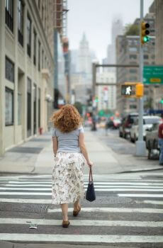 Woman crossing street.
