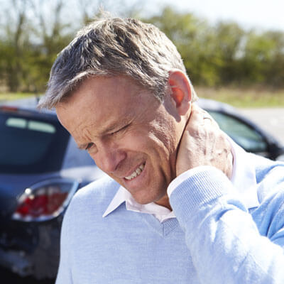 Man with sore neck from auto accident