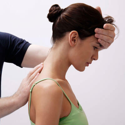 chiropractor treating female patient