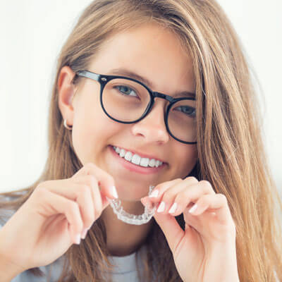 Girl with invisalign braces