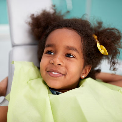 little girl smiling at dental check up