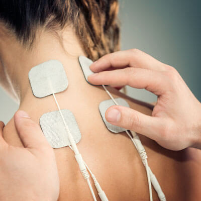 Muscle Stim therapy applied to neck