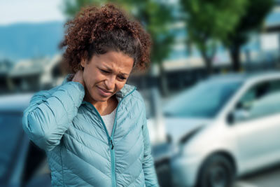 Woman with neck pain from auto accident