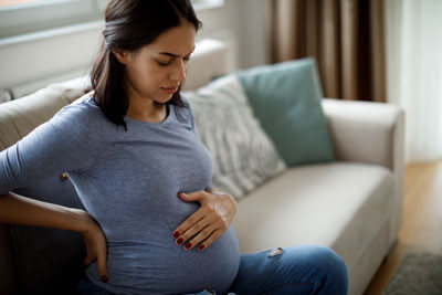 Woman with pregnancy discomfort