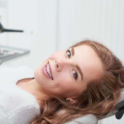 Teen with braces in dental chair
